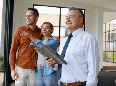Real estate agent showing property to clients